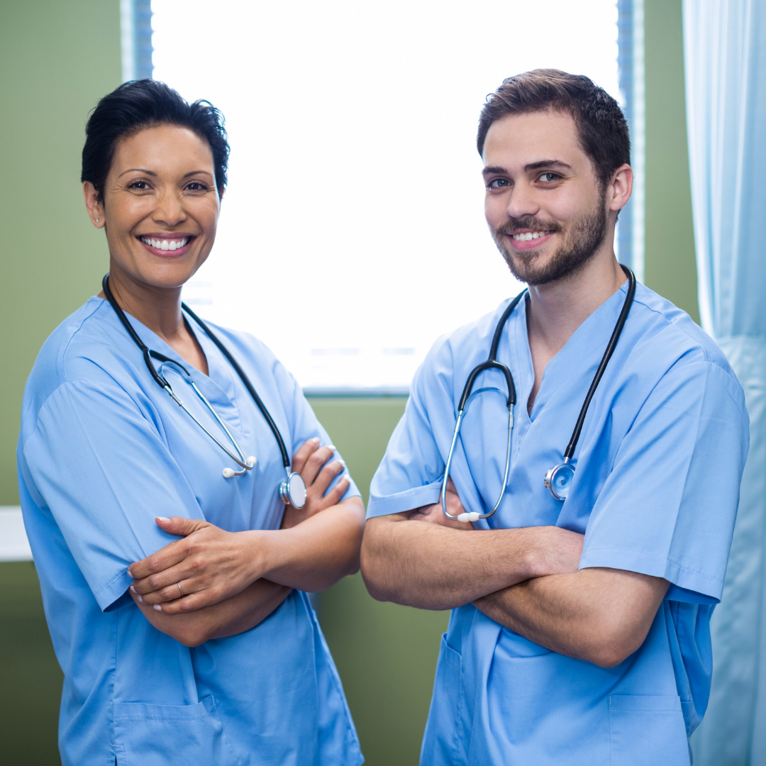 Male and Female Nurse Smiling About the Competencies 